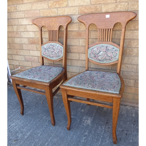 281 - A pair of early 20th century light oak and upholstered Arts & Crafts/Art Nouveau side chairs: each w... 