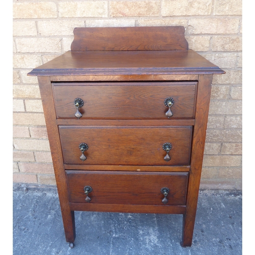 328 - An early 20th century chest: galleried moulded top above three full-width drawers with Art Deco styl... 