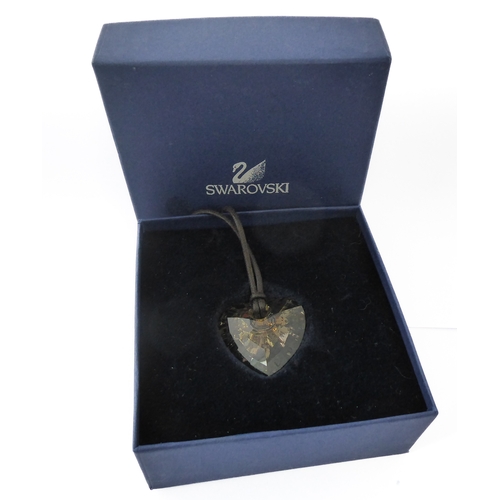 115 - A modern heart-shaped Swarovski pendant on a lace-style suspension band (original box)