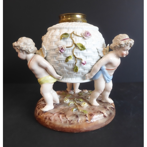 17 - A late 19th century hand-decorated continental porcelain lamp-base: modelled as three cherubs suppor... 