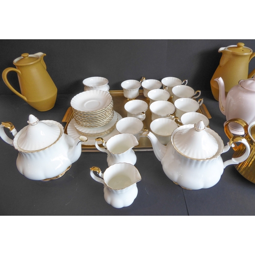 31 - A Royal Albert 'Val D'or' tea service comprising:
 2 teapots;
 2 milk jugs and 2 sugars;
 11 cups an... 