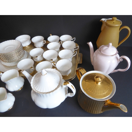 31 - A Royal Albert 'Val D'or' tea service comprising:
 2 teapots;
 2 milk jugs and 2 sugars;
 11 cups an... 