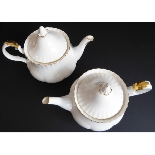 31 - A Royal Albert 'Val D'or' tea service comprising:
 2 teapots;
 2 milk jugs and 2 sugars;
 11 cups an... 