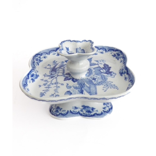 38 - An unusual 19th century blue-and-white pattern oyster server of quatrefoil form and with raised cent... 