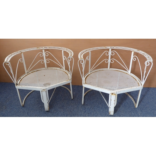 461 - An unusual pair of wrought, hammered and cast iron white-painted garden tub chairs loosely in the st... 