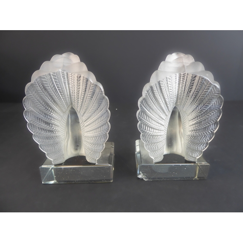 51 - A pair of Lalique-style (unsigned) moulded glass bookends modelled as turtle doves; the doves with a... 