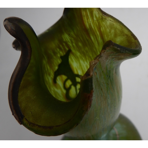 55 - A circa 1900 Loetz iridescent glass vase with silver overlay as sinuous flowers (chip to rim)