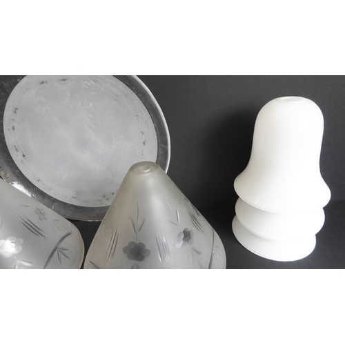 58 - Eleven glass lampshades and a frosted glass shallow dish:
 a set of 6 thick conical frosted-glass sh... 