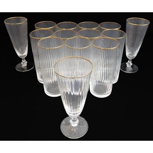 62 - A set of 11 Murano fluted water glasses with gilded rims (14 cm) and three matching wine glasses (15... 