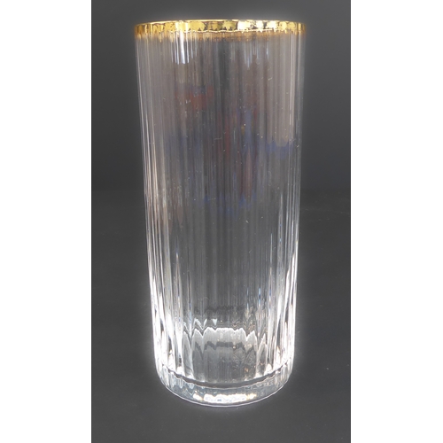 64 - A set of 23 Murano fluted water glasses with gilded rims (14 cm) and one similar but slightly larger... 