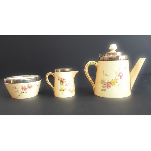 9 - A late 19th century Royal Worcester three-piece bachelor's coffee service: silver-mounted blush porc... 