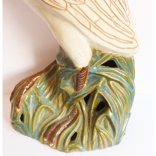 2 - A life-size ceramic model of a heron stepping through reeds: majolica glazes, probably mid-20th cent... 