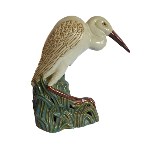 2 - A life-size ceramic model of a heron stepping through reeds: majolica glazes, probably mid-20th cent... 