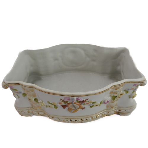 12 - A small ceramic group to include a late 19th century double vase by Moore modelled as flower encrust... 