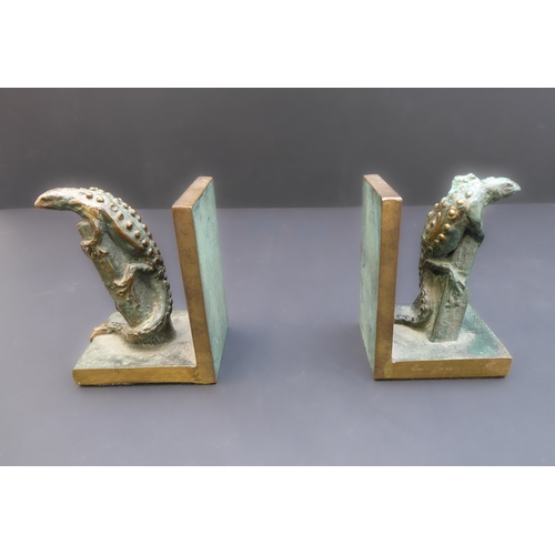 173A - An unusual pair of limited edition (3/25) patinated bronze bookends modelled as similar lizards clim... 