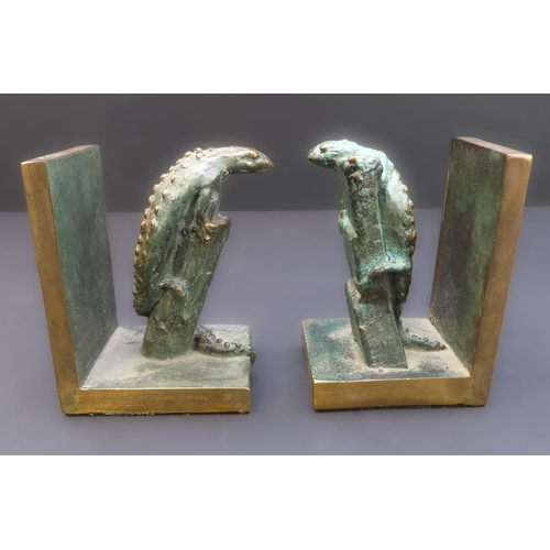 173A - An unusual pair of limited edition (3/25) patinated bronze bookends modelled as similar lizards clim... 