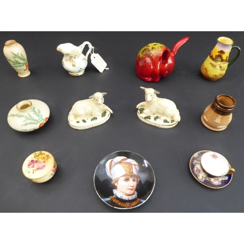 28 - Eleven miniature ceramics to include:
 a pair of 19th century Staffordshire-style recumbent lambs (1... 
