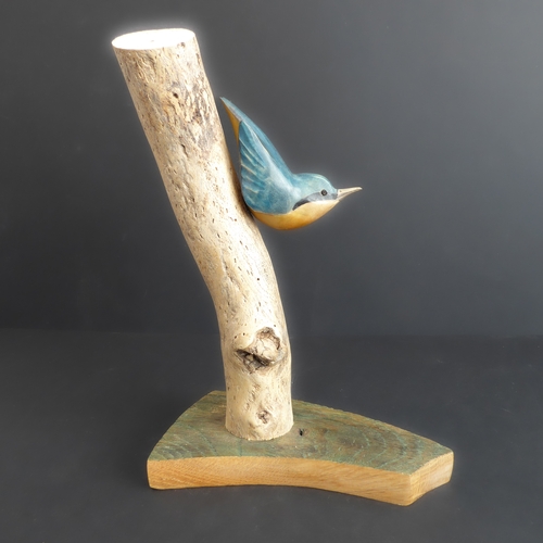 375 - JOHN MAINWARING, a good and realistic wooden carving of a nuthatch on a branch, signed and annotated... 