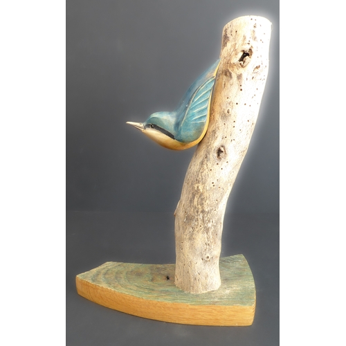 375 - JOHN MAINWARING, a good and realistic wooden carving of a nuthatch on a branch, signed and annotated... 