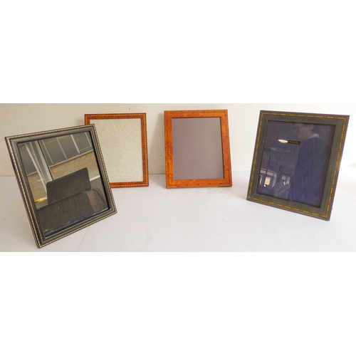 384 - Four good photo frames:
 Smythson black leather (28.5 x 23.5 cm);
 Addison Ross (30.5 x 25.5 cm);
 t... 