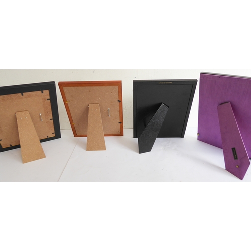 384 - Four good photo frames:
 Smythson black leather (28.5 x 23.5 cm);
 Addison Ross (30.5 x 25.5 cm);
 t... 