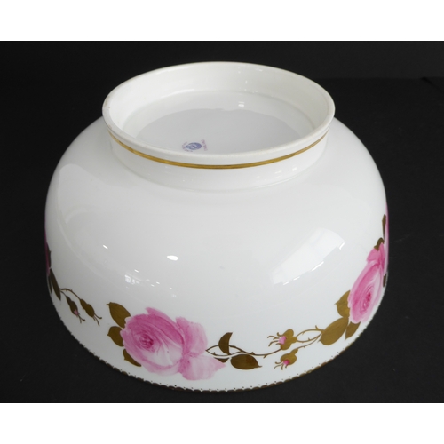 39 - An early 20th century George Jones ceramic bowl: hand-gilded and decorated with pink roses in border... 