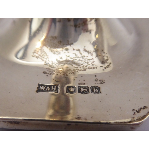 200 - A pair of neo-classical style tapering candlesticks with a relief band of swags and bows, tapering d... 