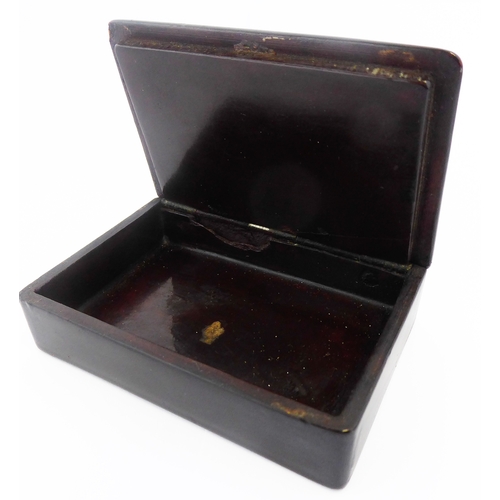 357 - In the manner of Stobwasser, an early/mid 19th century rectangular papier-mâché snuff box: the hinge... 