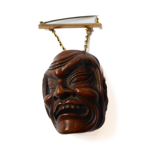 359 - A very finely carved Japanese wooden Noh mask (Omote): the male figure open-mouthed and alert, inter... 