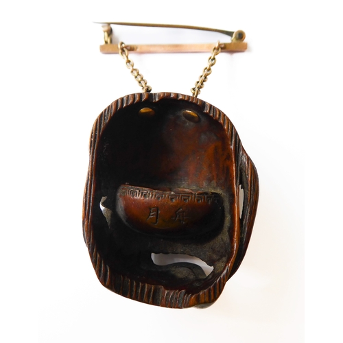 359 - A very finely carved Japanese wooden Noh mask (Omote): the male figure open-mouthed and alert, inter... 