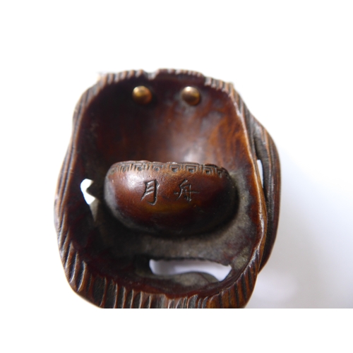 359 - A very finely carved Japanese wooden Noh mask (Omote): the male figure open-mouthed and alert, inter... 