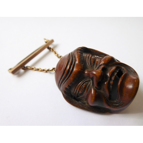 359 - A very finely carved Japanese wooden Noh mask (Omote): the male figure open-mouthed and alert, inter... 