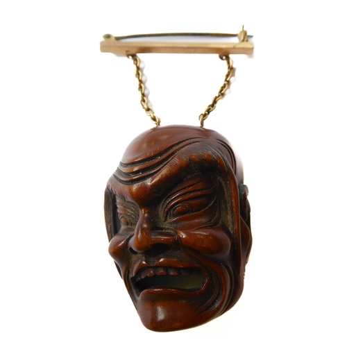359 - A very finely carved Japanese wooden Noh mask (Omote): the male figure open-mouthed and alert, inter... 