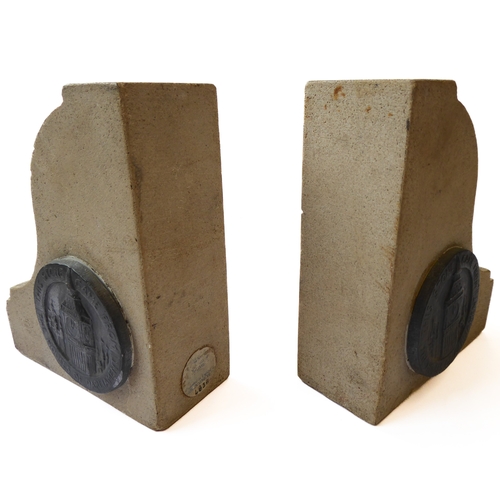 367 - An unusual pair of heavy Portland stone bookends made from stone from the Houses of Parliament after... 