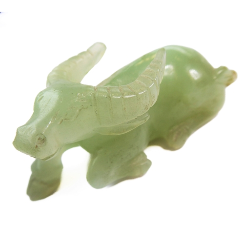400 - A Qing Dynasty carved Chinese celadon jade model of a recumbent water buffalo (6.5cm), together with... 