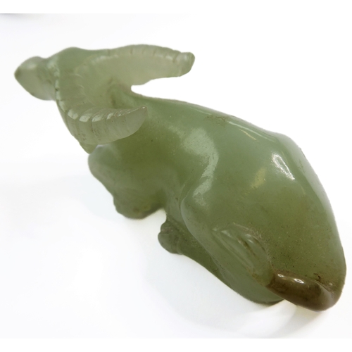 400 - A Qing Dynasty carved Chinese celadon jade model of a recumbent water buffalo (6.5cm), together with... 