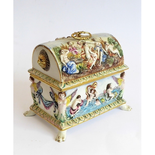 42 - A modern Capo di Monte porcelain dome-topped casket decorated in high relief with classical style fi... 