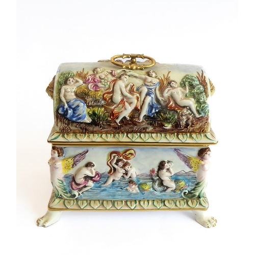 42 - A modern Capo di Monte porcelain dome-topped casket decorated in high relief with classical style fi... 