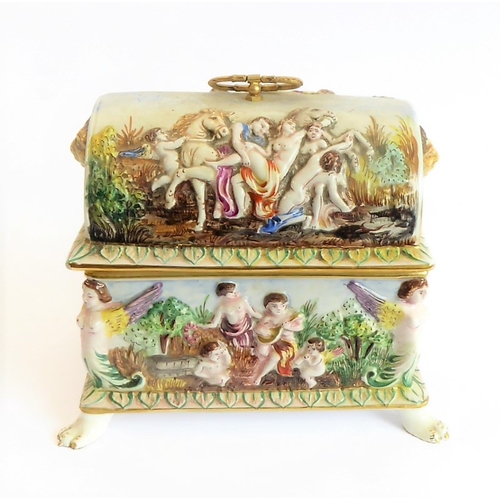 42 - A modern Capo di Monte porcelain dome-topped casket decorated in high relief with classical style fi... 