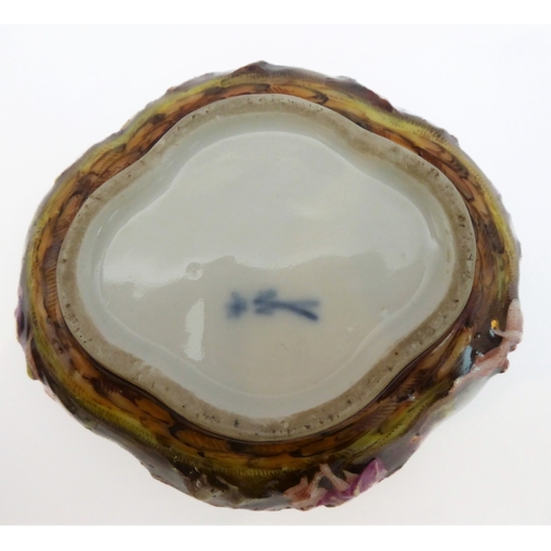 50A - A late 19th century quatrefoil-shaped, continental porcelain box and cover in Capo di Monte style: h... 