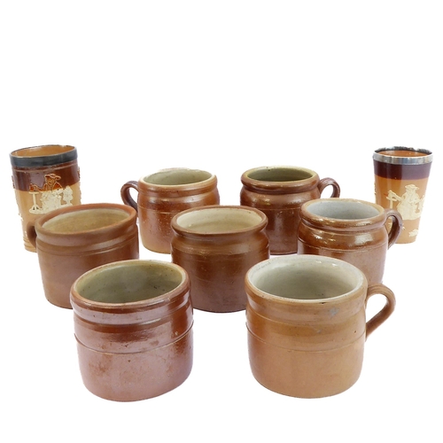 55 - Seven salt-glazed stoneware ale tankards each with ribbed strap handles, together with a Doulton Lam... 