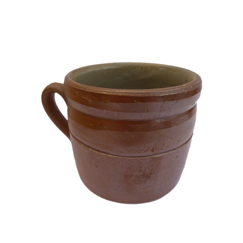 55 - Seven salt-glazed stoneware ale tankards each with ribbed strap handles, together with a Doulton Lam... 