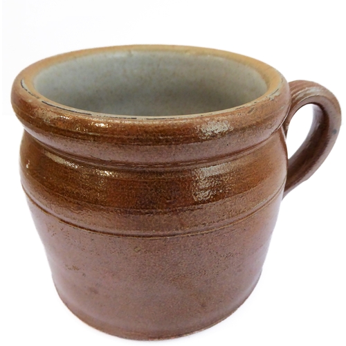 55 - Seven salt-glazed stoneware ale tankards each with ribbed strap handles, together with a Doulton Lam... 