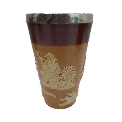 55 - Seven salt-glazed stoneware ale tankards each with ribbed strap handles, together with a Doulton Lam... 