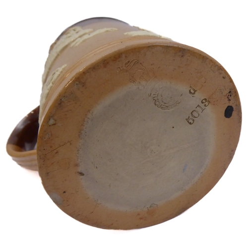 55 - Seven salt-glazed stoneware ale tankards each with ribbed strap handles, together with a Doulton Lam... 