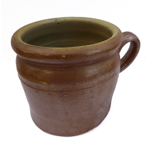 55 - Seven salt-glazed stoneware ale tankards each with ribbed strap handles, together with a Doulton Lam... 