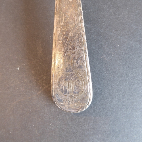 187 - Six large and heavy 18th century hallmarked silver serving spoons: each with bright-cut decoration a... 