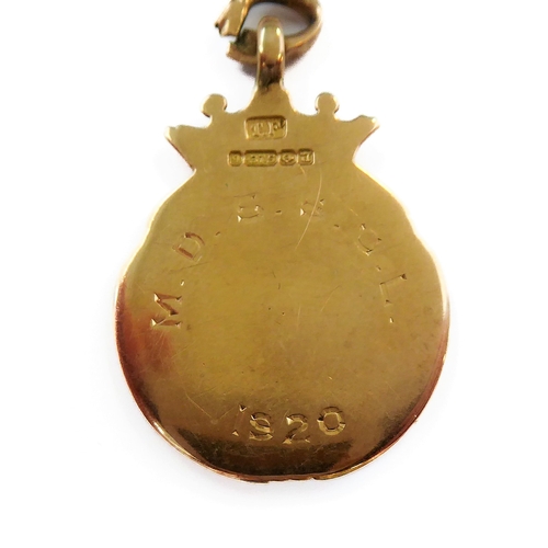 228 - A 9-carat yellow gold graduated curb link chain with two swivel terminals and suspending 9-carat yel... 