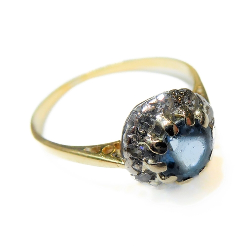 229 - A blue topaz/aquamarine and diamond-set cluster ring: the circular mixed-cut blue topaz/aquamarine (... 