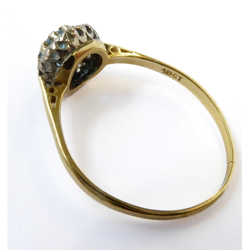 229 - A blue topaz/aquamarine and diamond-set cluster ring: the circular mixed-cut blue topaz/aquamarine (... 